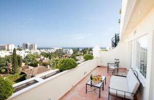 a balcony with a view of the city at Apartamentos Guadalpin Boutique in Marbella