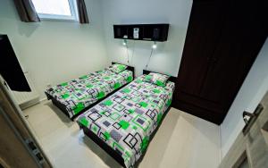 Кровать или кровати в номере Apartamenty Sun & Snow Karpacz Skalna