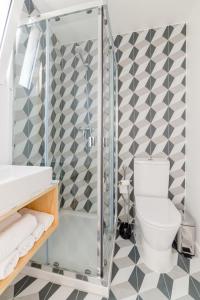 a bathroom with a shower and a toilet at Lisbon heart 1-cozy Flat-Family Friendly in Lisbon +19 photos