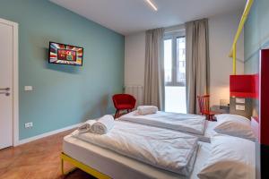 A bed or beds in a room at MEININGER Milano Garibaldi