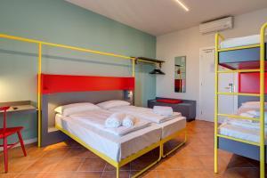 A bed or beds in a room at MEININGER Milano Garibaldi