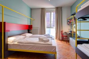 A bed or beds in a room at MEININGER Milano Garibaldi