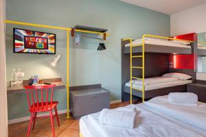 A bed or beds in a room at MEININGER Milano Garibaldi