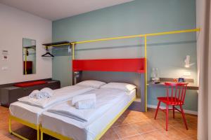 A bed or beds in a room at MEININGER Milano Garibaldi