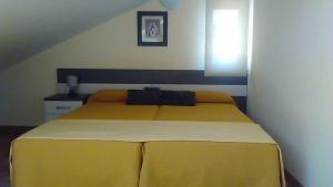 Posteľ alebo postele v izbe v ubytovaní Hostal Doña Juana