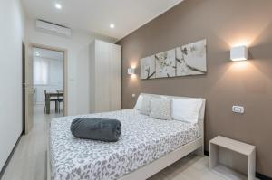 En eller flere senger på et rom på Holiday Home Taormina 3