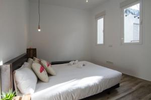 Łóżko lub łóżka w pokoju w obiekcie Luminoso familiar- 2D 2B- Cava Alta