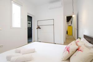 Łóżko lub łóżka w pokoju w obiekcie Luminoso familiar- 2D 2B- Cava Alta
