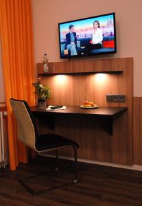 TV a/nebo společenská místnost v ubytování Garni Hotel Leitl GmbH