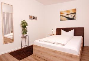 Postel nebo postele na pokoji v ubytování Garni Hotel Leitl GmbH