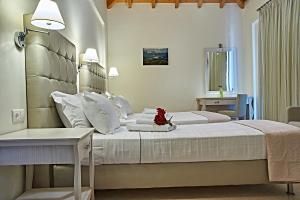 a hotel room with two beds and a table at Element Hotel in Elafonisos