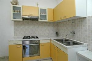 Kuchyň nebo kuchyňský kout v ubytování Apartment M&M