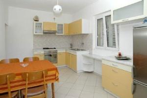 Kuchyň nebo kuchyňský kout v ubytování Apartment M&M