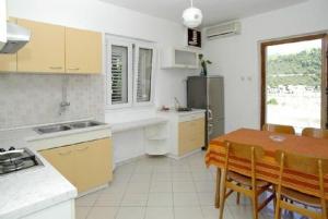 Kuchyň nebo kuchyňský kout v ubytování Apartment M&M + 13 fotografií