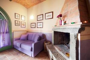 A seating area at Villa il Pino by VacaVilla