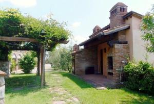 A garden outside Villa il Pino by VacaVilla