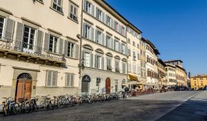 a row of bikes parked on the side of a building at Boboli Living in Florence