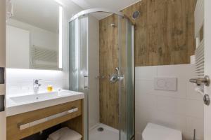 Koupelna v ubytování M Hotel