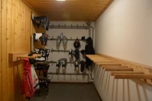 a garage with a bunch of tools hanging on the wall at Landhaus Jetzbach in Piesendorf