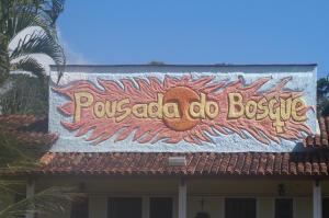 a sign on the top of a building at Pousada Do Bosque in Itajuípe
