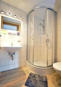 a bathroom with a shower and a sink at Landhaus Antonia in Seefeld in Tirol +39 photos