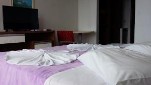 Ένα ή περισσότερα κρεβάτια σε δωμάτιο στο Hotel Monte Líbano