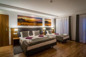 Posteľ alebo postele v izbe v ubytovaní Hotel Górski