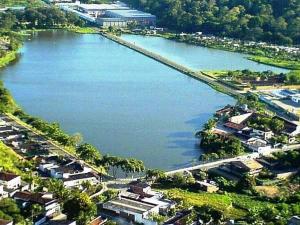an aerial view of a river with a bridge at Pousada Do Bosque in Itajuípe