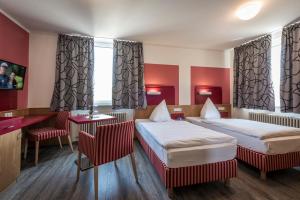 Ένα ή περισσότερα κρεβάτια σε δωμάτιο στο Kloster Neustadt