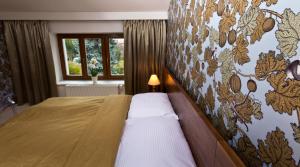 Giường trong phòng chung tại Residence Arx & Wellness