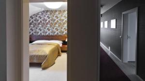 Giường trong phòng chung tại Residence Arx & Wellness