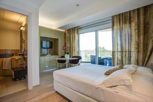 Кровать или кровати в номере Hotel Premier & Suites - Premier Resort