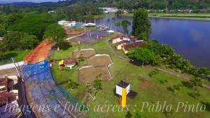 an aerial view of a park next to a lake at Pousada Do Bosque in Itajuípe