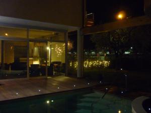 The swimming pool at or close to Residence Rivachiara (check-in at Hotel Riviera in Viale Rovereto, 95)