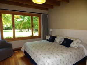 Ένα ή περισσότερα κρεβάτια σε δωμάτιο στο Hosteria El Establo