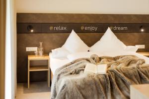 A bed or beds in a room at enjoy ischgl