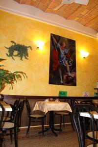 a dining room table with a picture of a woman on it at Hotel Bolognese in Rome