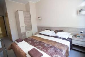 Postel nebo postele na pokoji v ubytování Fala1 Ośrodek Wypoczynkowy + 6 fotografií