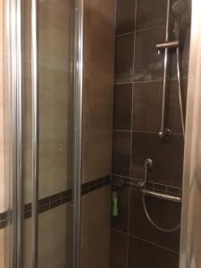 a shower with a glass door in a bathroom at La casa nel sole - Boutique B&B in Bari