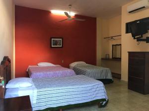 Postel nebo postele na pokoji v ubytování Hotel Estrella del Mar