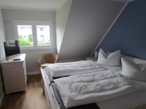 Ein Bett oder Betten in einem Zimmer der Unterkunft Dorie