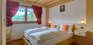 Ένα ή περισσότερα κρεβάτια σε δωμάτιο στο Chalet Mott