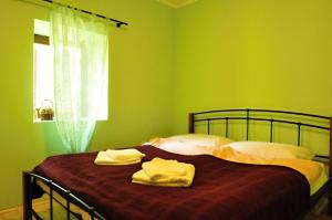 En eller flere senge i et værelse på Villa Saint Vid