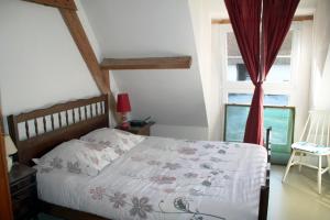 Ein Bett oder Betten in einem Zimmer der Unterkunft ferme de Méraville