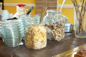 a table with three jars of granola on it at Il Giardino in Foce Varano