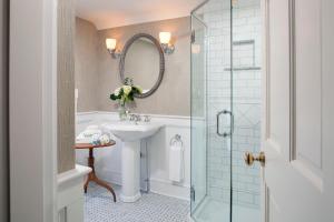 a bathroom with a sink and a glass shower at The Jackson in Woodstock +42 photos
