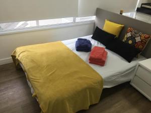 Łóżko lub łóżka w pokoju w obiekcie Allianz Park, Perdizes