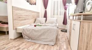 a living room with two beds in a room at SpongeBob Apartment in Vienna