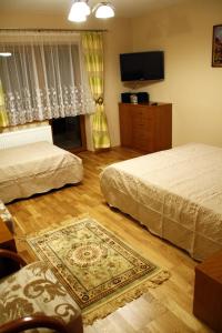 Posteľ alebo postele v izbe v ubytovaní Apartamenty- Mieszkania Wakacyjne