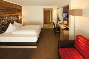 Letto o letti in una camera di Hotel Fernblick